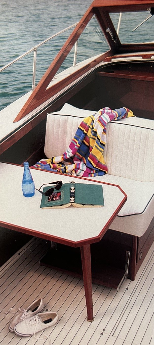 Skiff Craft cockpit interior — white upholstery and mahogany trim.